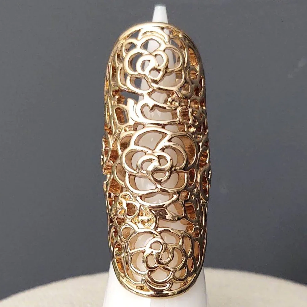 Long, open scroll design gold ring